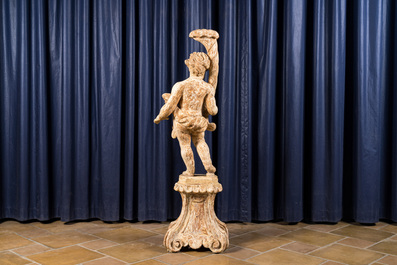 A large white patinated wooden putto holding a cornucopia, 18th C.