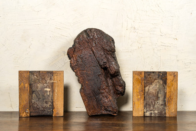 A carved oak cherub's head and a pair of 'Lamb of God' panels, 17th C.