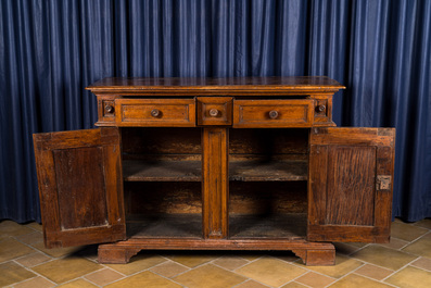 An Italian walnut sideboard with two doors and three drawers, 18th C.