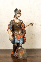 A polychrome and gilt wooden figure of a Roman soldier, 18th C.