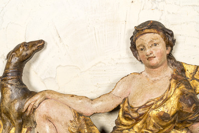 A polychromed and gilt wood carving depicting the goddess Diana and her dog, 17th C.