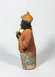 A French polychrome terracotta fireplace in the shape of a pipe smoking Moor, ca. 1900