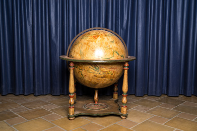 A celestial globe on a polychrome wooden base, 19th C.