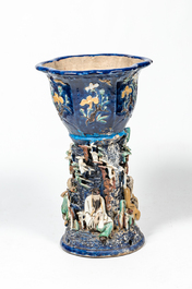 A Chinese polychrome Shiwan pottery jardini&egrave;re on stand with applied design of scholars, 19th C.