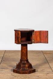 An octagonal mahogany one-door cabinet table, 19th C.