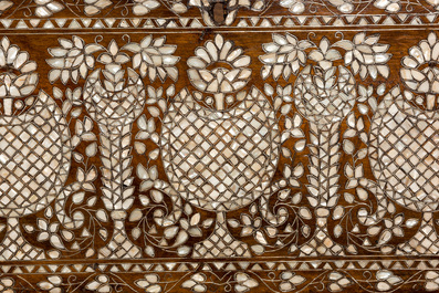 A Syrian mother-of-pearl-inlaid wooden bridal chest on stand, 19th C.