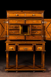 A cabinet on foot in various woods inlaid with faux tortoiseshell, 20th C.