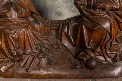 A carved walnut retable fragment depicting the 'Coronation of the Virgin', Southern Netherlands, ca. 1480
