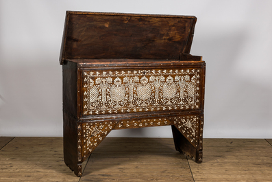 A Syrian mother-of-pearl-inlaid wooden bridal chest on stand, 19th C.