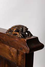 A large Gothic Revival oak hooded throne chair with dragons and frogs, 19th C.