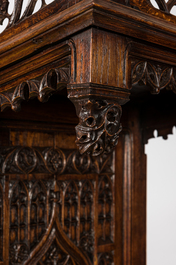 A large Gothic Revival oak hooded throne chair with dragons and frogs, 19th C.