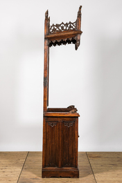 A large Gothic Revival oak hooded throne chair with dragons and frogs, 19th C.