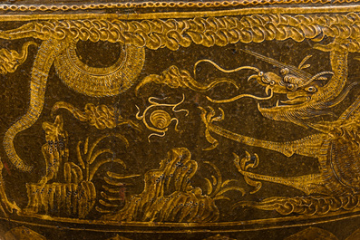 An exceptionally large Chinese or Vietnamese oval 'dragon and phoenix' pottery basin, 18/19th C.