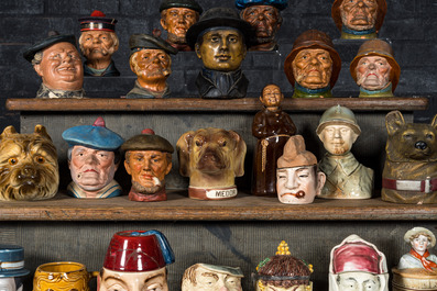 A collection of barbotine tobacco jars in the shape of heads of men and animals, 19/20th C.