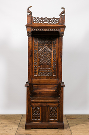 A large Gothic Revival oak hooded throne chair with dragons and frogs, 19th C.