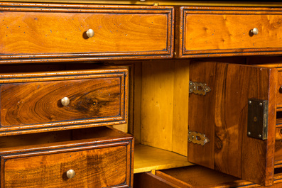 A cabinet on foot in various woods inlaid with faux tortoiseshell, 20th C.