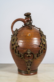 Four various stoneware jugs, incl. two bellarmine jugs and one with a gilt bronze chain mount, Raeren and Frechen, 17th C.