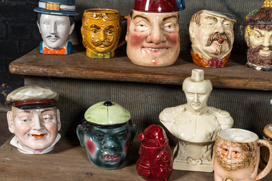 A collection of barbotine tobacco jars in the shape of heads of men and animals, 19/20th C.