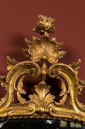 A French finely carved gilt wooden Louis XV-style rocaille mirror, 18/19th C.