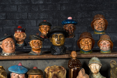 A collection of barbotine tobacco jars in the shape of heads of men and animals, 19/20th C.