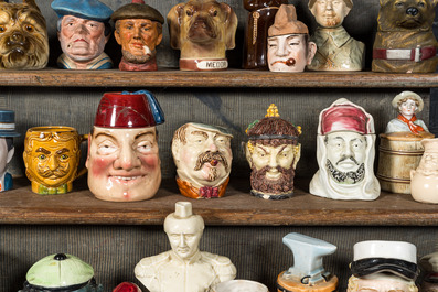 A collection of barbotine tobacco jars in the shape of heads of men and animals, 19/20th C.