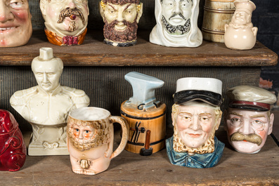 A collection of barbotine tobacco jars in the shape of heads of men and animals, 19/20th C.