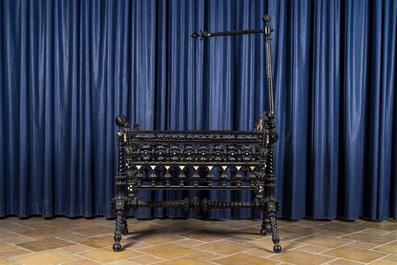 An attractive ebony-inlaid ebonised wooden cradle, 19th C.