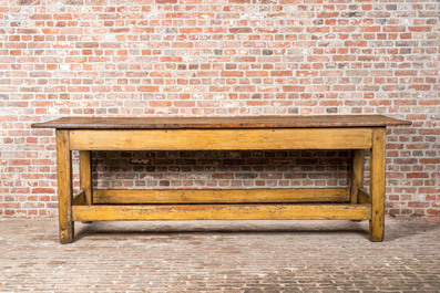 A long working table from a textile workshop in painted pine, 19/20th C.