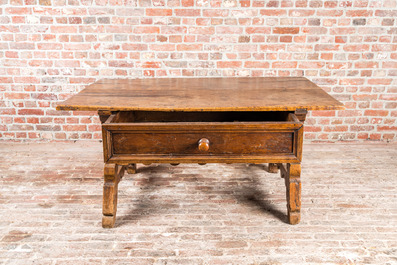 A presumably German walnut table with drawer, 18th C.