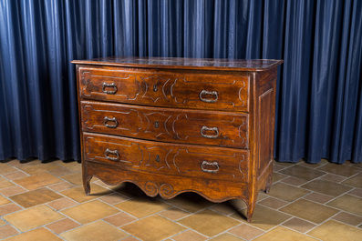 An Italian walnut chest of drawers, 18th C.