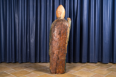 A polychrome wooden figure of a bishop, 16th C.