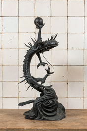 A large Japanese bronze okimono with a dragon holding the pearl of wisdom, Meiji, 19th C.