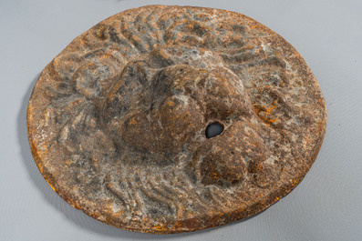 Four cast iron medallions with a lion's head, 19th C.