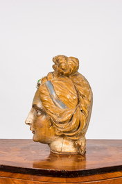 A polychrome wooden head of a female saint, 18th C.