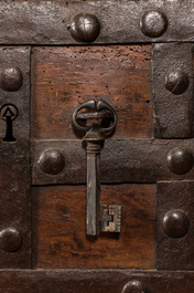 A wrought iron-mounted wooden coffer, 17th C.