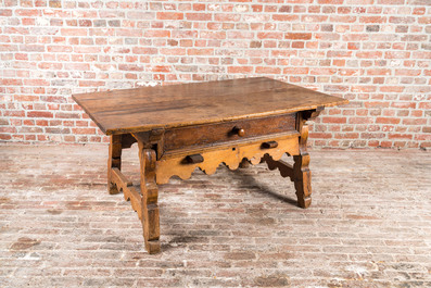 A presumably German walnut table with drawer, 18th C.