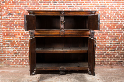 A Flemish ebonised and oak wooden four-door cabinet, 17th C.