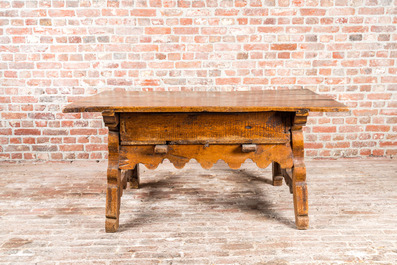 A presumably German walnut table with drawer, 18th C.