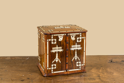 A wooden bone-decorated liqueur cellar with two carafes, two glasses and a travel bottle, 19th C.