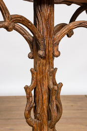 A 'Black Forest' wooden jardini&egrave;re on tripod stand, ca. 1900