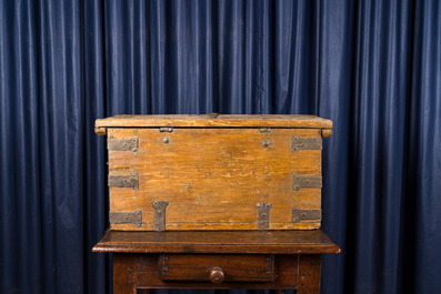 A wooden trunk with wrought iron mounts, 18th C.