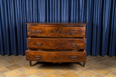 An Italian walnut chest of drawers, 18th C.