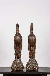 A pair of polychrome wooden flamingos, 20th C.