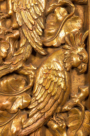 A gilt plaster relief with macaws, 20th C.