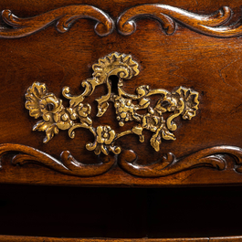 A French Louis XV-style walnut chest of drawers, 19th C.