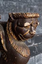 Two pairs of sculpted wooden table legs in the shape of lions, 19th C.