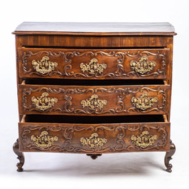 A French Louis XV-style walnut chest of drawers, 19th C.