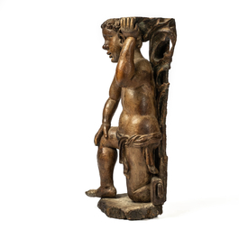 A wooden atlant in the shape of a kneeling boy, 17th C.