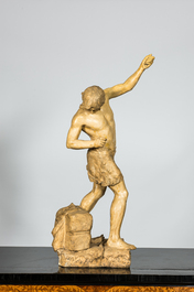 Een gepatineerde gipsen sculptuur van een jonge man op een vlot, 20e eeuw