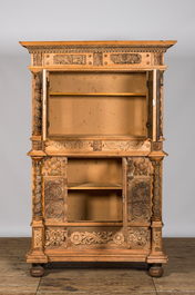 A German baroque leached walnut three-door cabinet, 18th C. with later elements